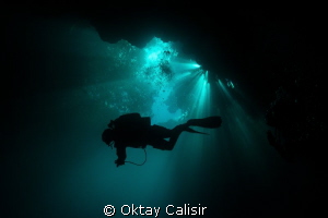 Silhouette of Cave Diver in Mexico - Cenotes by Oktay Calisir 